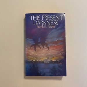 This Present Darkness by Frank E. Peretti Vintage Paperback 
1986